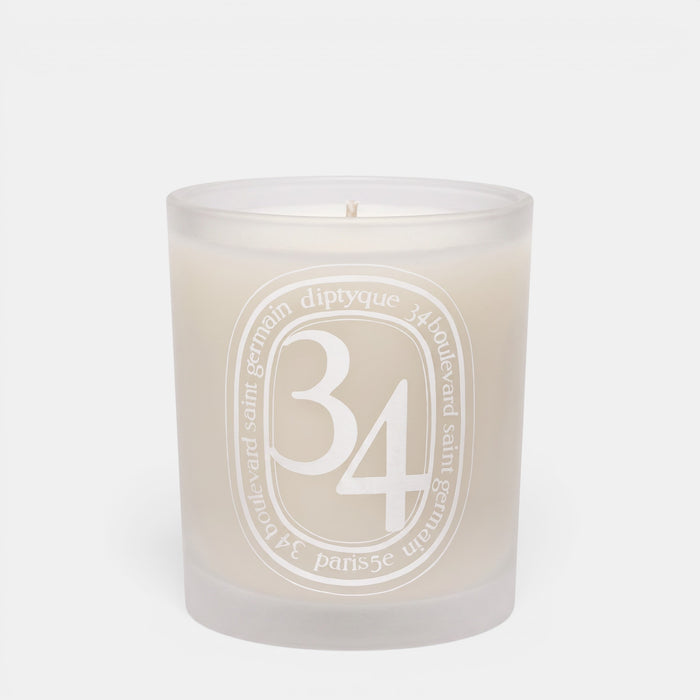 Shop Rescue Spa 34 Boulevard Saint Germain scented candle in a white opaline glass vessel with signature branding.