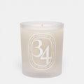 Shop Rescue Spa 34 Boulevard Saint Germain scented candle in a white opaline glass vessel with signature branding.