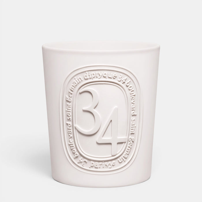Shop Rescue Spa Diptyque 34 Boulevard Saint Germain scented candle in a white opaline glass vessel with embossed logo