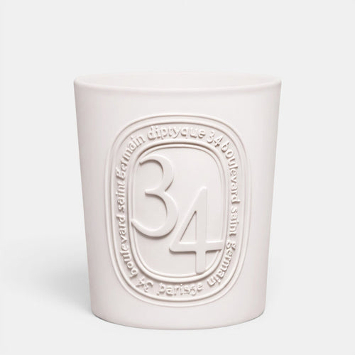 Shop Rescue Spa Diptyque 34 Boulevard Saint Germain scented candle in a white opaline glass vessel with embossed logo