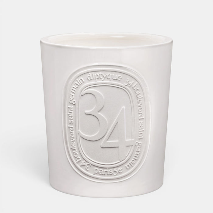 Shop Rescue Spa Diptyque 34 Boulevard Saint Germain scented candle in a white opaline vessel with embossed branding.