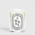 Shop Rescue Spa Diptyque Ambre scented candle in a clear glass vessel with a signature oval label
