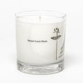 Candle in a clear glass jar with 'Maison Louis Marie' branding on a white background