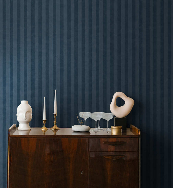 Aquila Stripes wallpaper in navy on a feature wall