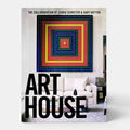 Shop Rescue Spa Art House book featuring colorful geometric art above a white sofa and coffee table.