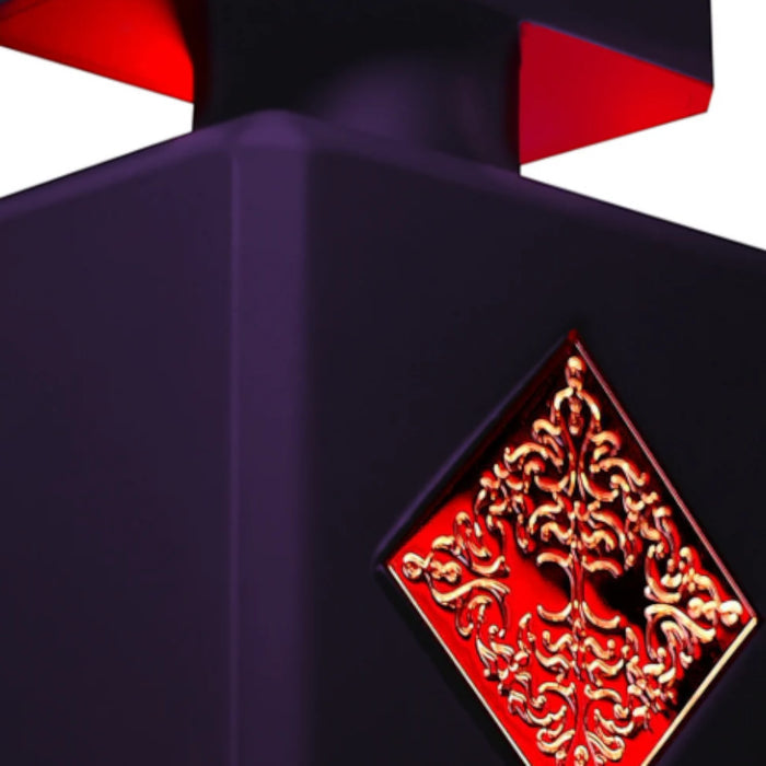 Shop Rescue Spa Atomic Rose Eau De Parfum bottle, deep purple with red accents and ornate gold emblem.