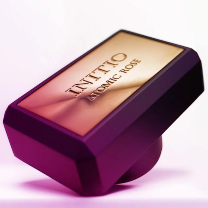 Shop Rescue Spa Atomic Rose Eau De Parfum bottle with gold top and purple base. Unisex fragrance made in France.