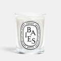 Shop Rescue Spa Baies scented candle in a clear glass vessel with a black and white label featuring blackcurrant notes
