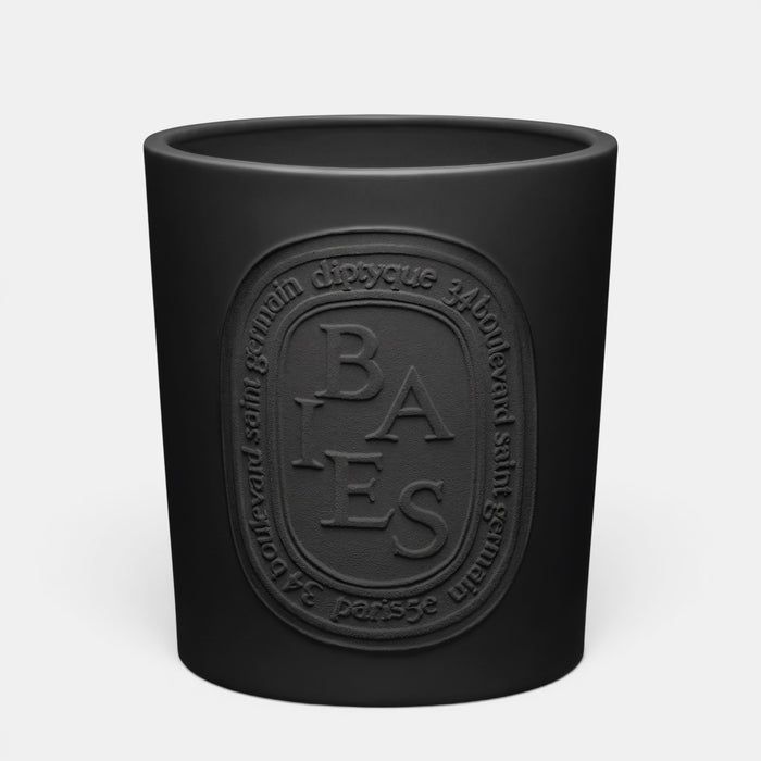 Shop Rescue Spa Baies scented candle in a matte black glass vessel with an embossed oval logo label