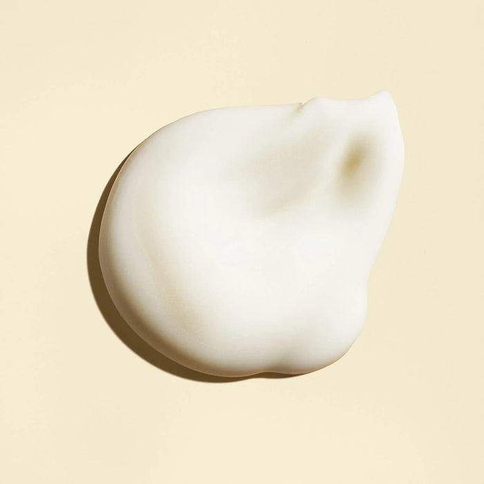 Shop Rescue Spa Balm d'Or Heat Styling Shield, a white creamy texture on a pale yellow background.