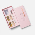 Shop Rescue Spa Black Baccara Bond Rejuvenating Luxe Cure hair treatment set with four vials, brush, and mixing cup.