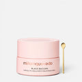 Shop Rescue Spa Black Baccara hair mask in a light pink jar with a gold applicator spoon on a white background.