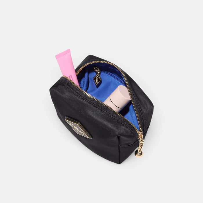 Shop Rescue Spa black nylon Ava cosmetic bag with blue interior lining, leather trim, and matte black hardware.