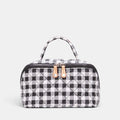 Shop Rescue Spa black and white gingham accordion cosmetic bag with top handle, leather trim, and silver hardware.