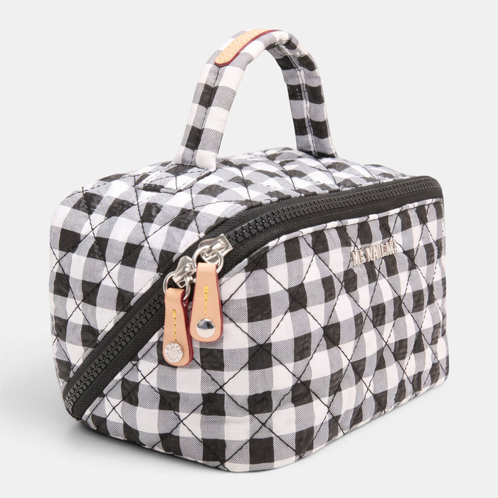 Shop Rescue Spa black and white gingham quilted nylon accordion cosmetic bag with top handle and silver hardware.