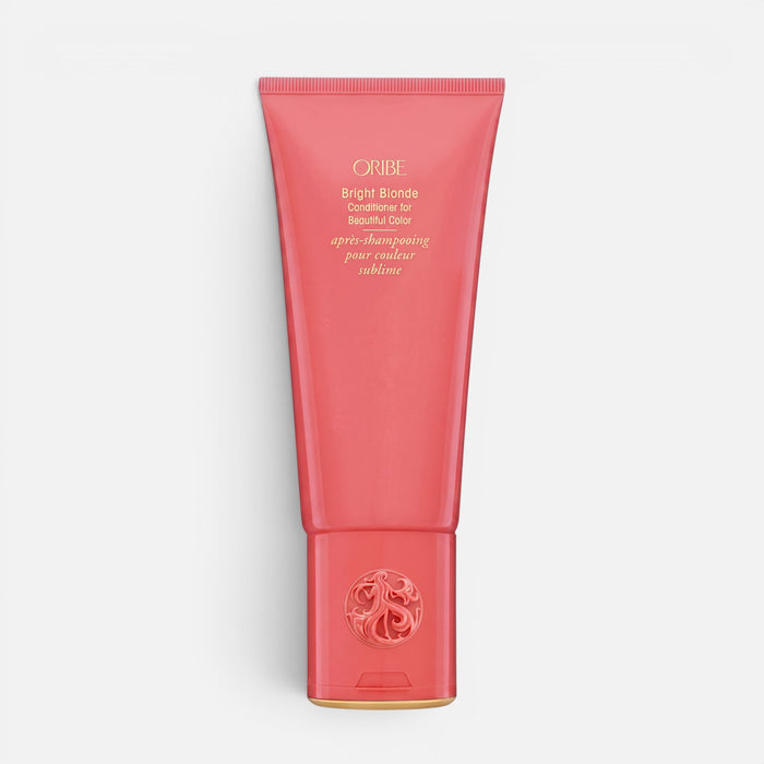 Shop Rescue Spa Oribe Bright Blonde Conditioner in a coral-colored squeeze tube for toning blonde and silver hair.
