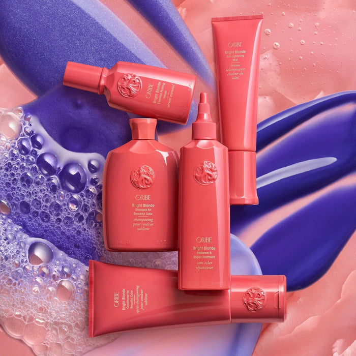 Oribe Bright Blonde Radiance & Repair Treatment 175ml, a coral pink tube with violet pigments to eliminate brassiness and repair hair.
