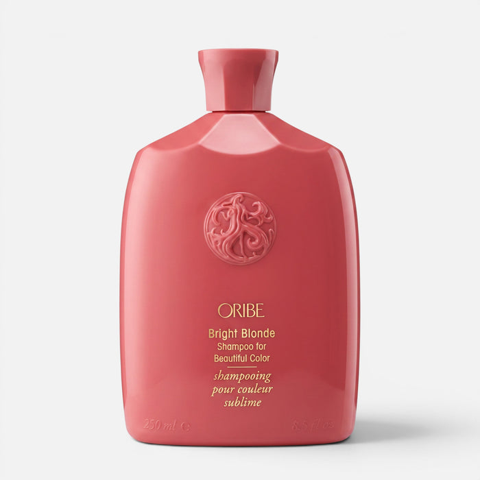 Shop Rescue Spa Oribe Bright Blonde Shampoo in a coral bottle for toning brassy hair and brightening highlights.