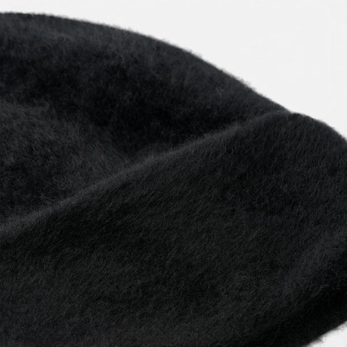 Shop Rescue Spa black brushed 100% cashmere knit beanie with a soft, fuzzy texture.