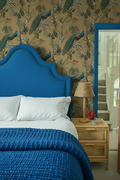 Bedroom with no cushions, chunky knit electric blue bedspread