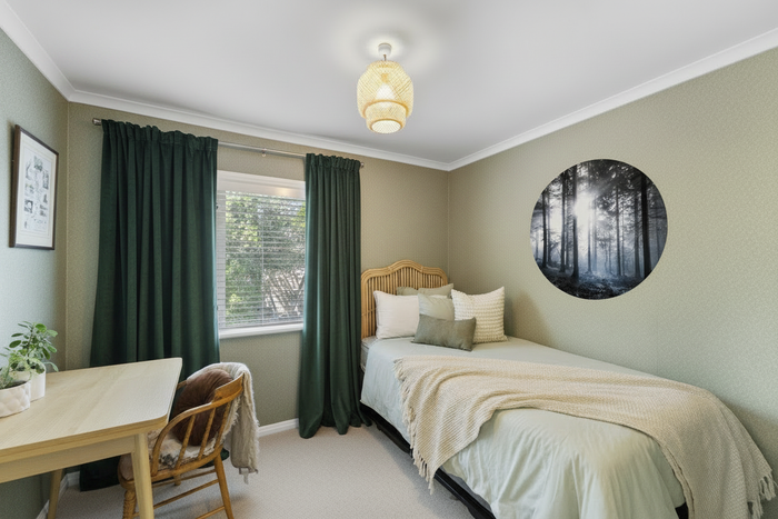 Bedroom with green curtains and RD5533 mural
