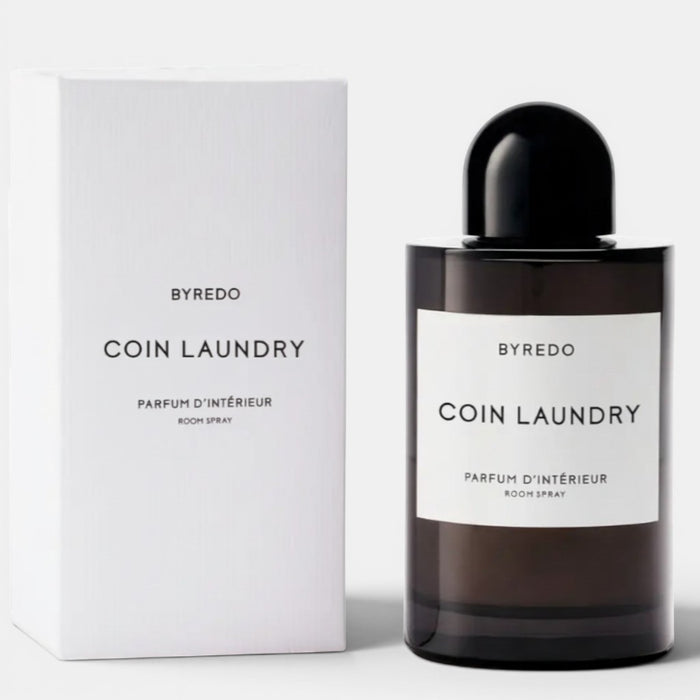 Shop Rescue Spa Byredo Coin Laundry Room Spray, a dark glass bottle with a black cap and white label, next to its white box.