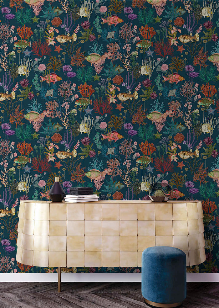 Cora Fish and Coral wallpaper in navy on a feature wall