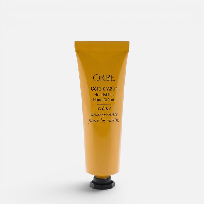 Shop Rescue Spa Oribe Cote d'Azur Nourishing Hand Creme in a golden yellow squeeze tube for dry skin hydration.