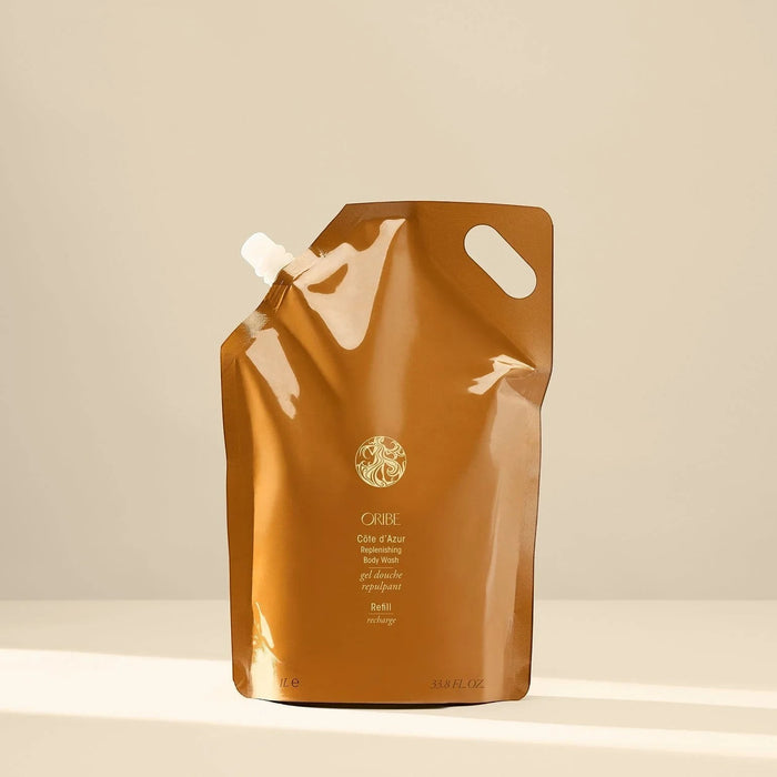 Shop Rescue Spa Oribe Cote d'Azur Replenishing Body Wash refill pouch, 33.8 fl oz, with a white spout and handle.