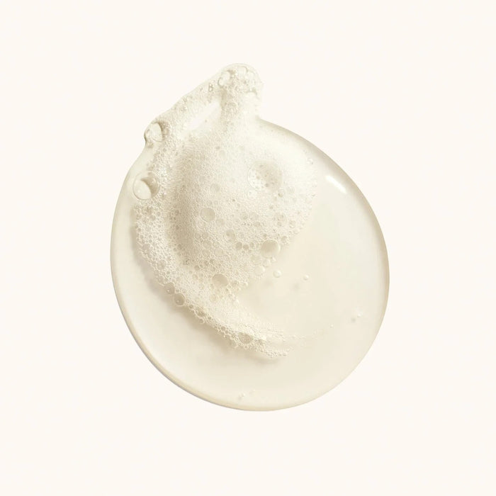 Shop Rescue Spa Cote d'azur Replenishing Body Wash swatch with light foam and bubbles.