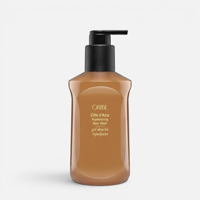 Shop Rescue Spa Oribe Cote d'Azur Replenishing Body Wash in a brown pump bottle for skin hydration and brightening.