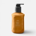 Shop Rescue Spa Oribe Cote d'Azur Restorative Body Creme in a mustard yellow pump bottle for deep skin hydration.