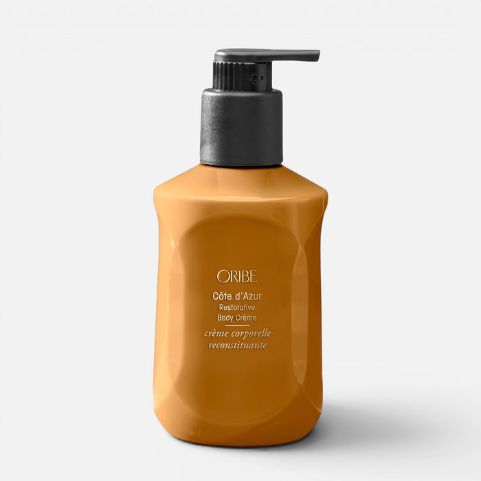 Shop Rescue Spa Oribe Cote d'Azur Restorative Body Creme in a mustard yellow pump bottle for deep skin hydration.