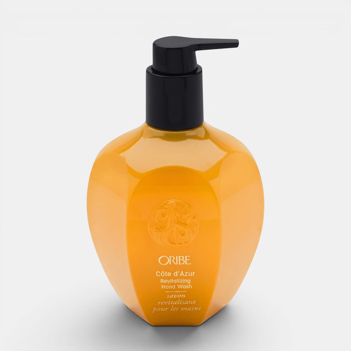 Shop Rescue Spa Oribe Cote d'Azur revitalizing hand wash in an amber bottle with a black pump dispenser.