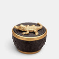 L'Objet porcelain candle vessel with a textured black crocodile finish and 24K gold crocodile lid.