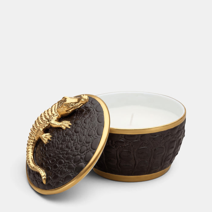 L'Objet porcelain candle with a black crocodile texture and a sculptural 24K gold crocodile lid.