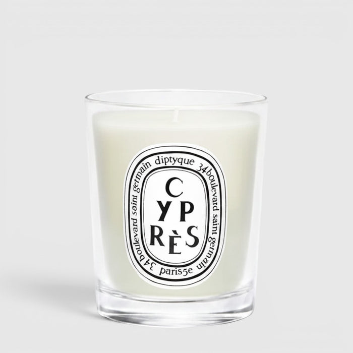 Shop Rescue Spa Cypres candle in a clear glass jar with a white wax finish and signature oval label