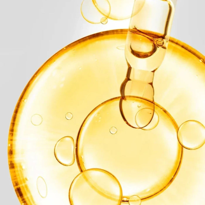 Shop Rescue Spa D7 Serum featuring a golden, vitamin-rich elixir with a dropper, creating a radiant, dewy skin effect.