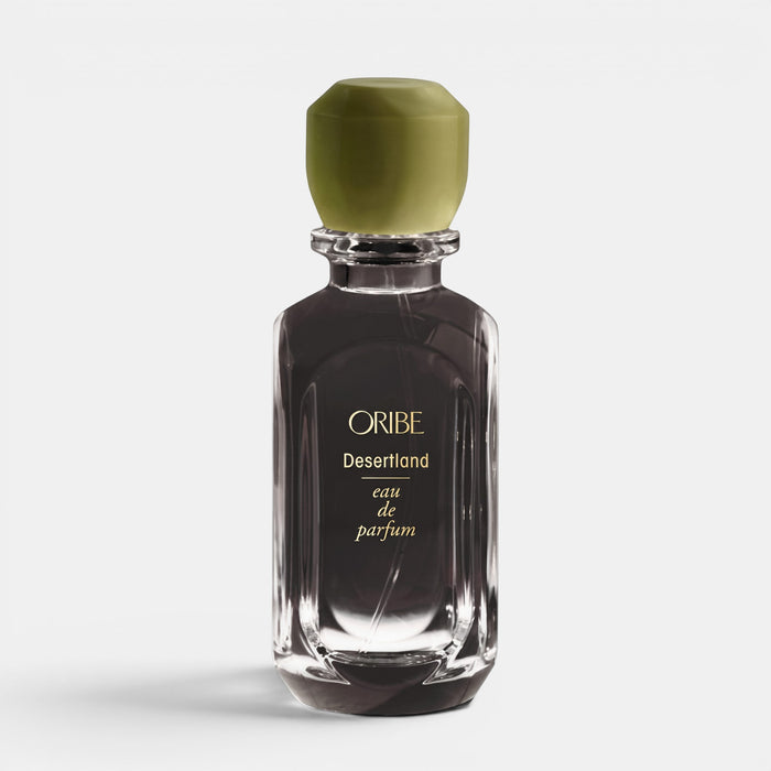Shop Rescue Spa Oribe Desertland eau de parfum in a clear glass bottle with a matte olive green cap.