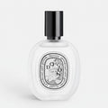 Shop Rescue Spa Do Son Hair Mist in a clear glass bottle with a black cap, featuring a white floral tuberose scent.