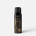 Shop Rescue Spa Oribe Dry Texturizing Spray in a black bottle with gold graphic details for hair volume and texture.