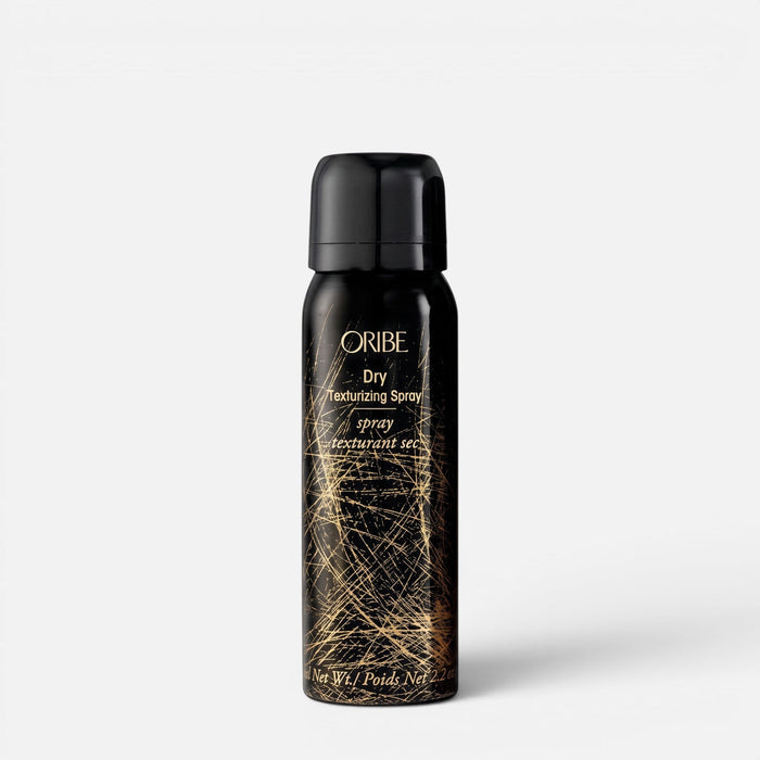 Shop Rescue Spa Oribe Dry Texturizing Spray in a black bottle with gold graphic details for hair volume and texture.