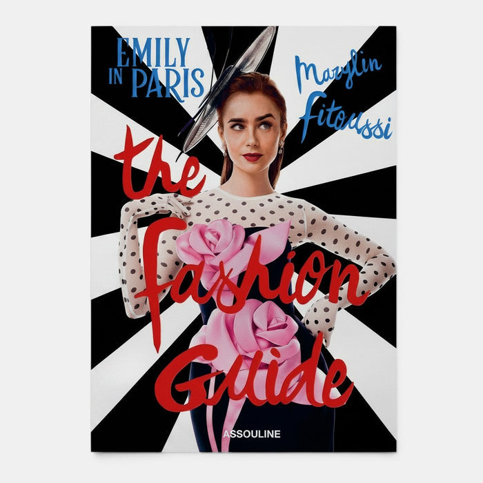 Shop Rescue Spa Emily in Paris: The Fashion Guide book cover featuring Lily Collins in a black dress with pink roses and polka dot sleeves.