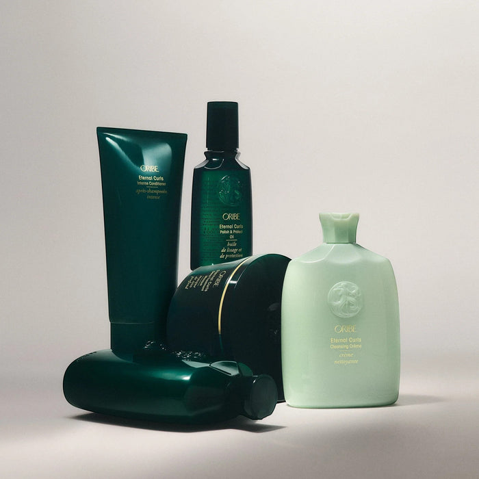 Shop Rescue Spa Oribe Eternal Curls Cleansing Creme, a pale green bottle with a mint green cap, for curly hair.