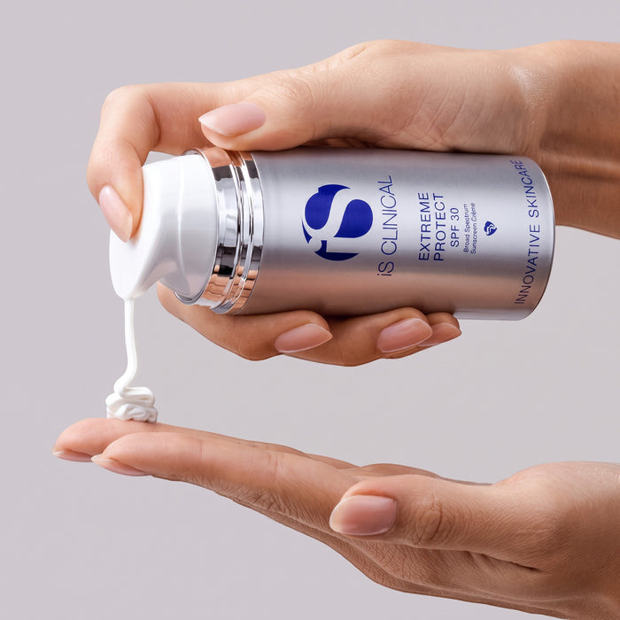 Shop Rescue Spa iS CLINICAL Extreme Protect SPF 30 cream being dispensed from a silver pump bottle onto a hand