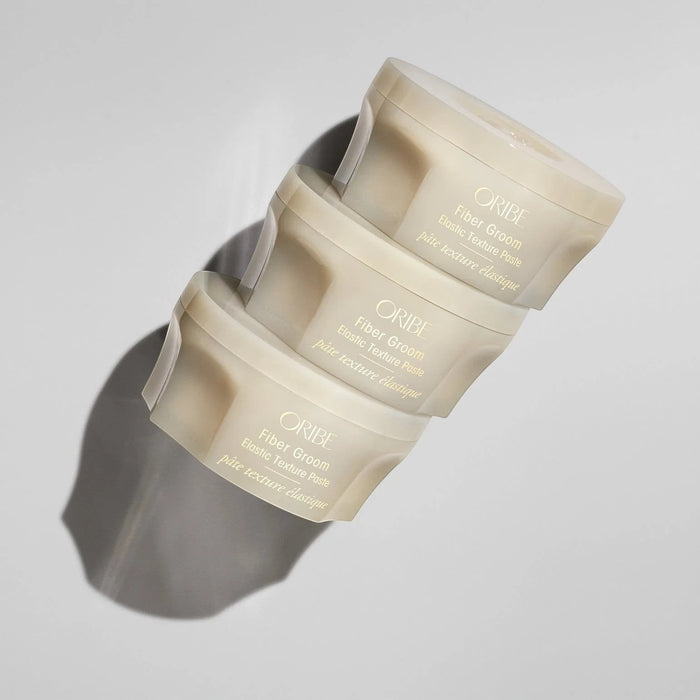 Shop Rescue Spa ORIBE Fiber Groom Elastic Texture Paste for airy, separated, and pliable hold. Light shine.