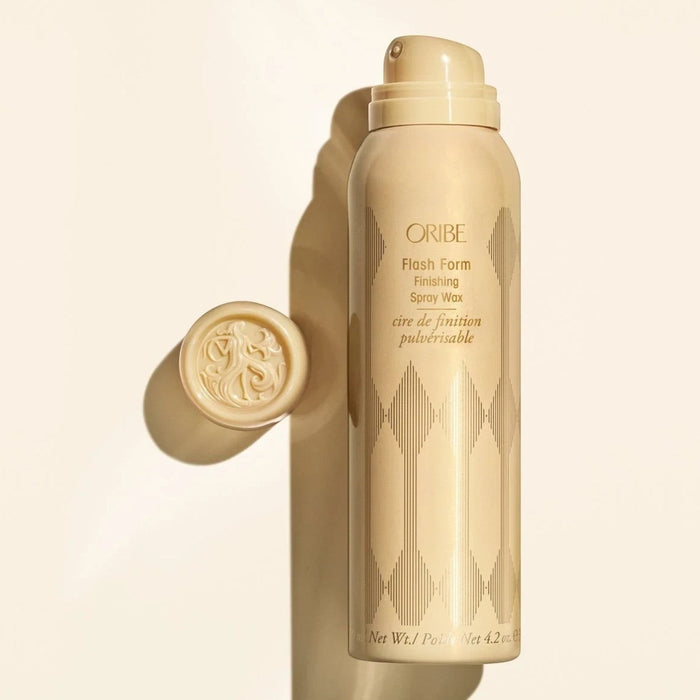 Shop Rescue Spa Oribe Flash Form Finishing Spray Wax in a beige bottle with gold geometric pattern. Includes cap.