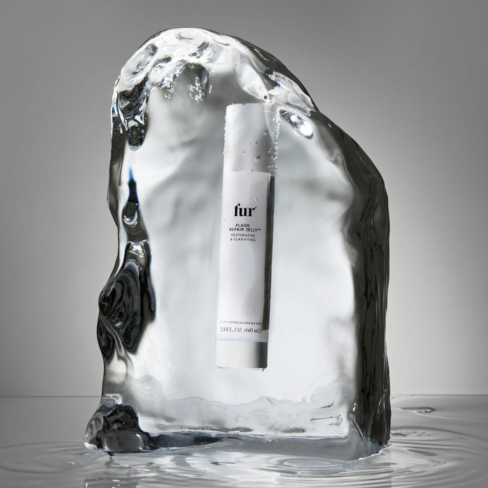 Shop Rescue Spa Flash Repair Jelly bottle encased in a block of clear ice, highlighting its cooling, soothing formula.