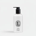 Shop Rescue Spa fresh body lotion in a 250ml white bottle with a black pump dispenser and orange blossom label