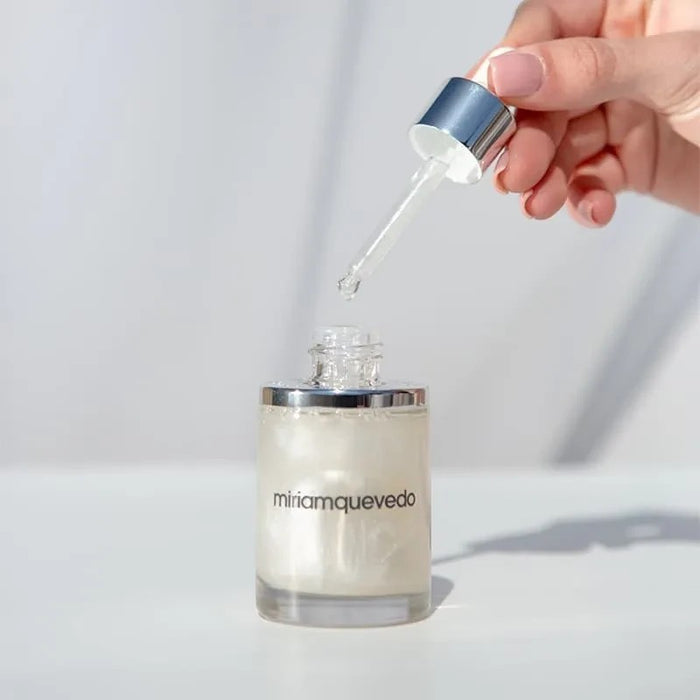 Shop Rescue Spa Glacial White Caviar Hydra-Pure Precious Elixir in a glass bottle with a silver dropper applicator